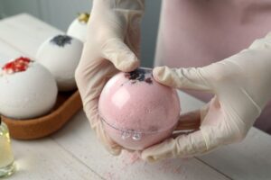 Read more about the article Unwrapping the Pleasure: Should You Remove the Plastic from Bath Bombs?